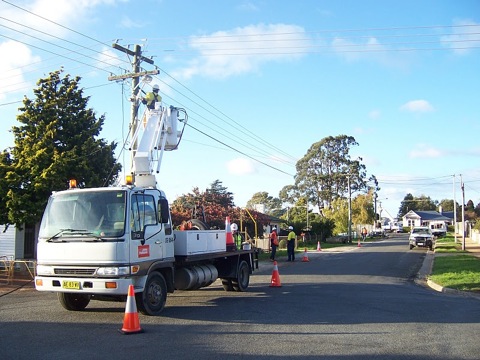 John Holland personnel deploying pole-to-pole National Broadband Network fibre in Scottsdale, Tasmania